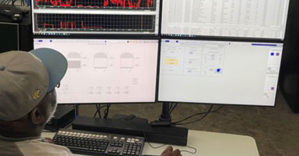 Figure 1: An operator at ExxonMobil’s Resin Finishing Plant monitors the plant’s operations using the new Open Process Automation console.