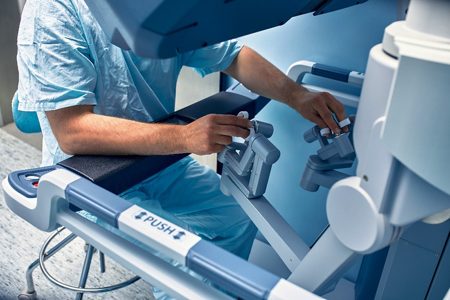 Figure 2:&nbsp;A surgeon manipulating a robotic surgical device.