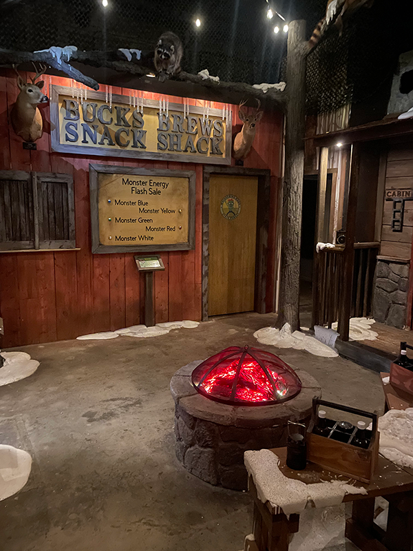 Figure 1: There is more to this campground-themed escape room than meets the eye. A sophisticated automation system monitors specialty inputs throughout the game space, triggering specific actions and reactions for a truly immersive and interactive experience.