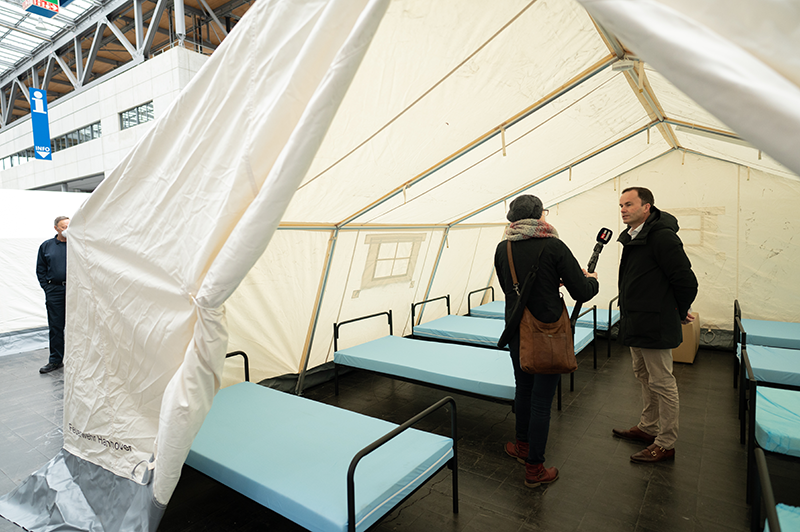Dr. Jochen Koeckler discusses refugee shelter details.