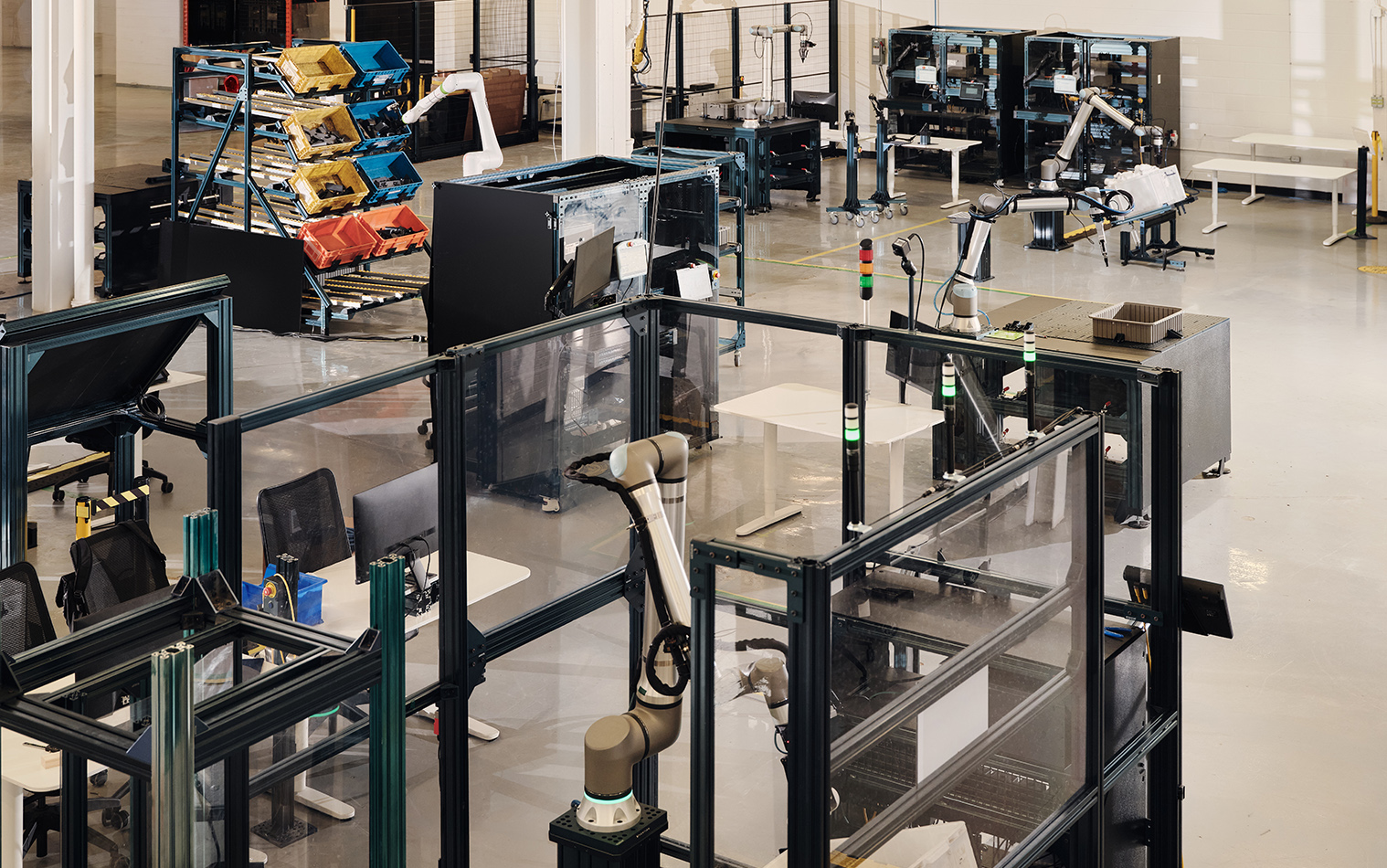 Equipment and workspaces inside the Vention_Physical AI Lab in Montreal, Canada.